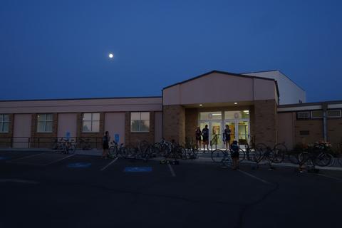 Preparing bikes for the day in the moonlight