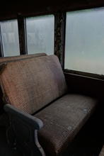 One of the seats on the train. It's a little worse fof wear but not ruined with age. 