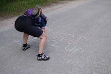 Helen chalking at the end of a long gravel road. 